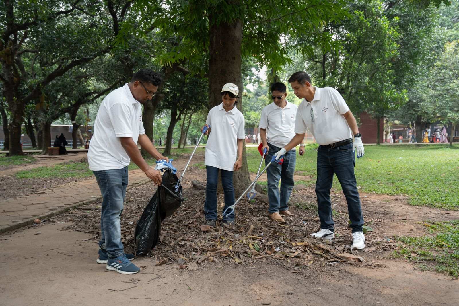 Volunteers cleaning up a shady neighborhood park