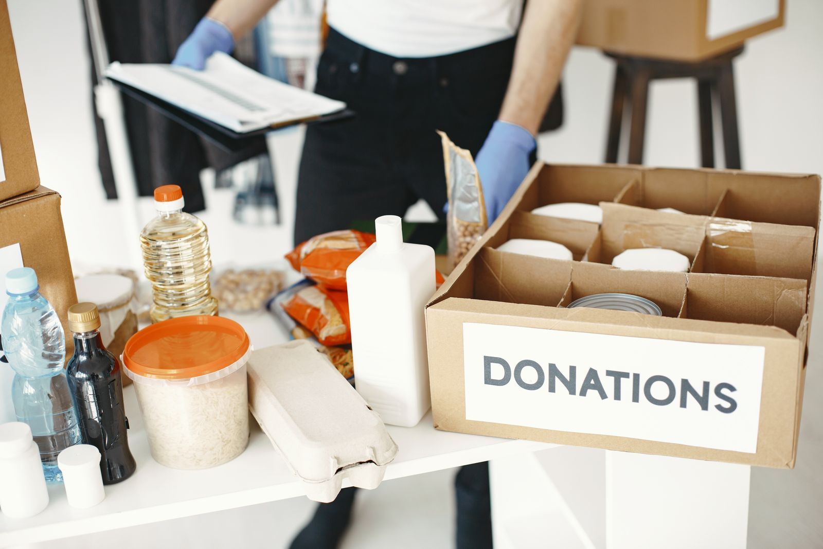 An open donation box filled with canned food, pasta and supplies